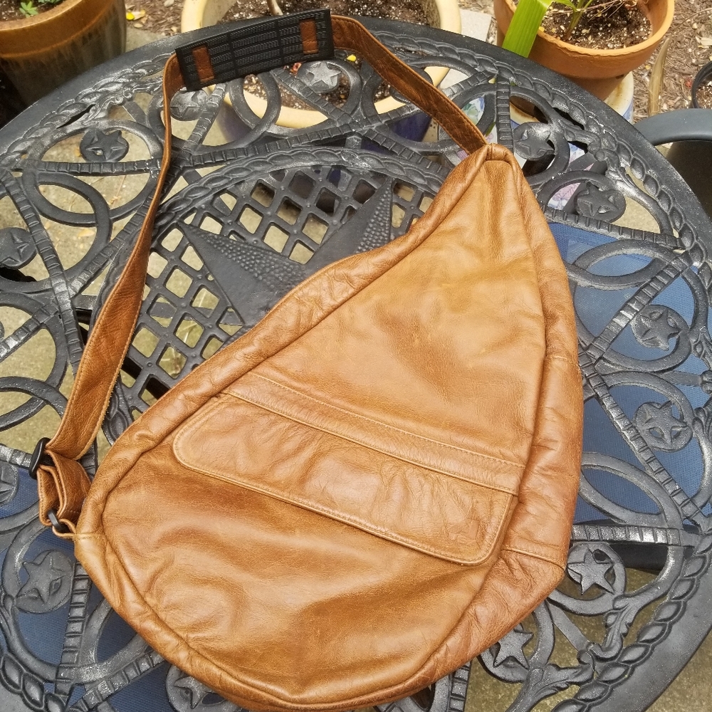 100% leather, tan, messenger bag